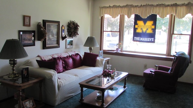 carpeted living room featuring a healthy amount of sunlight