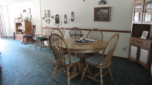 dining space featuring carpet