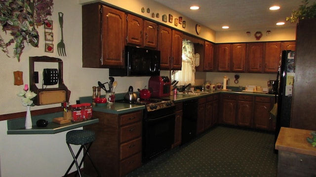 kitchen featuring black appliances and sink