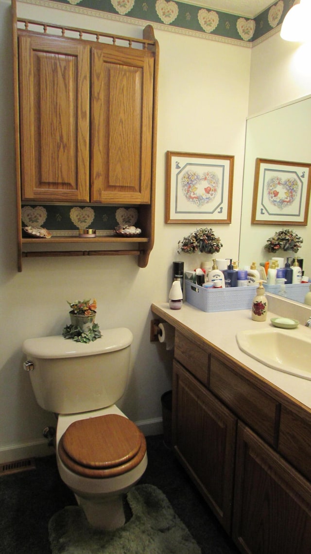 bathroom with vanity and toilet