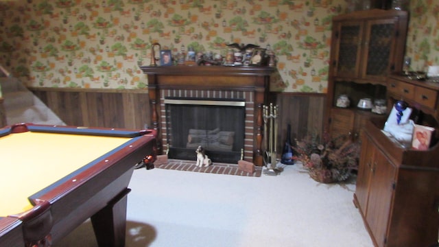 playroom featuring a fireplace, carpet floors, wood walls, and pool table