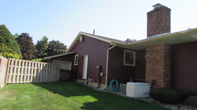 view of property exterior with a yard