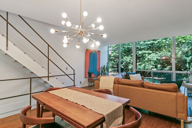 dining room featuring a chandelier, hardwood / wood-style floors, and expansive windows