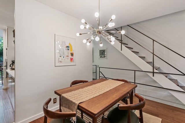 dining room with an inviting chandelier and hardwood / wood-style flooring