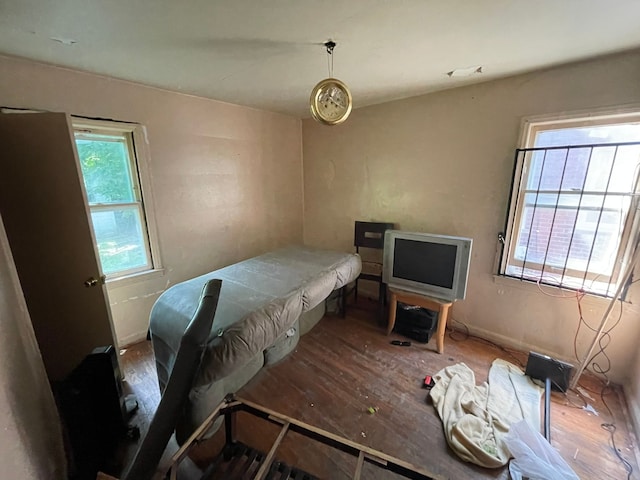 bedroom with hardwood / wood-style flooring