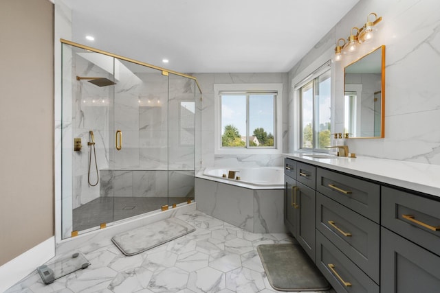 bathroom featuring vanity and separate shower and tub