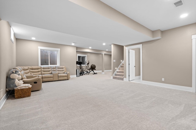 unfurnished living room featuring light carpet