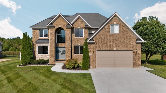 view of front of home with a garage and a front yard