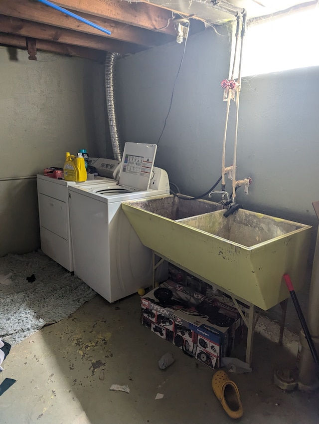 laundry room with washing machine and dryer and sink