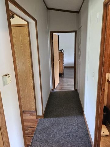 corridor with dark wood-type flooring