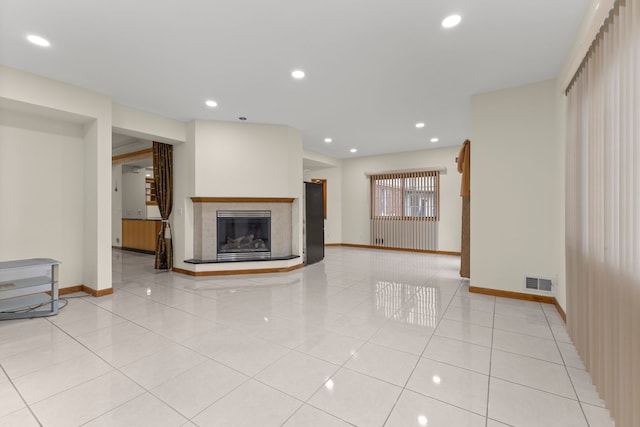 unfurnished living room with light tile patterned floors