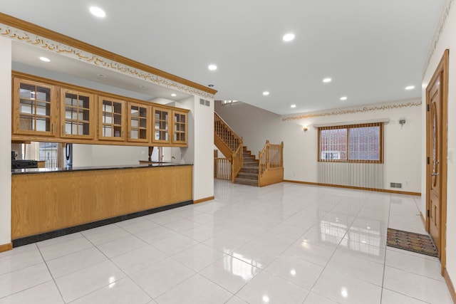 kitchen featuring ornamental molding and light tile patterned floors