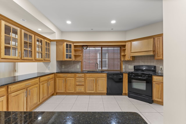 kitchen with decorative backsplash, dark stone counters, sink, black appliances, and light tile patterned floors