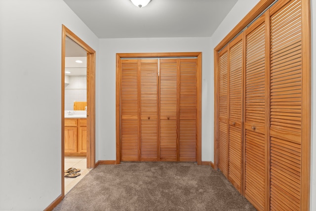 unfurnished bedroom featuring carpet floors and sink