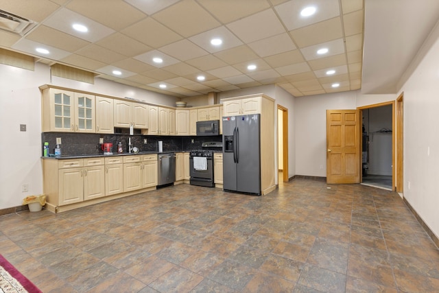 kitchen with sink, appliances with stainless steel finishes, and tasteful backsplash