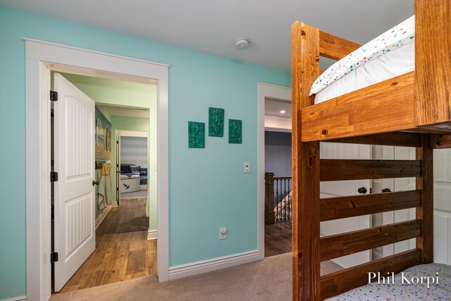 250 Shore Dr, Wayland, MI 49348 - bedroom featuring baseboards, carpet, and wood finished floors