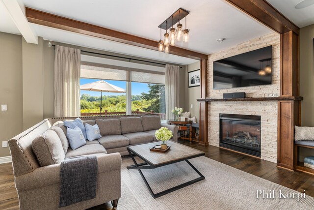 250 Shore Dr, Wayland, MI 49348 - living area with beam ceiling, wood finished floors, and a fireplace