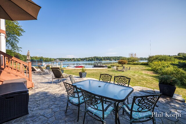 250 Shore Dr, Wayland, MI 49348 - view of patio / terrace featuring outdoor dining space and a water view