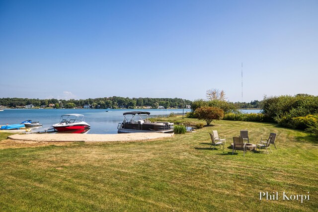 250 Shore Dr, Wayland, MI 49348 - view of green lawn featuring a dock and a water view