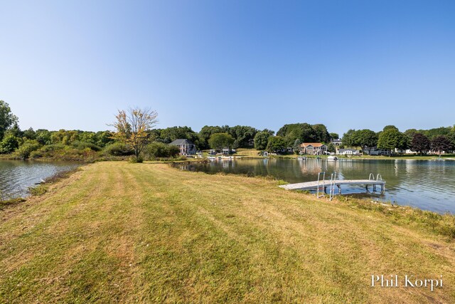 250 Shore Dr, Wayland, MI 49348 - dock area with a water view and a lawn
