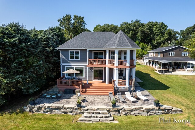 250 Shore Dr, Wayland, MI 49348 - rear view of property featuring a patio area, a fire pit, a balcony, a yard, and a deck