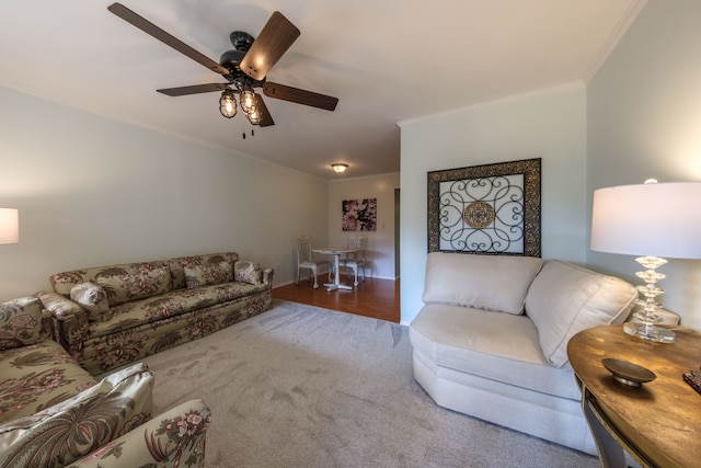 living room with ceiling fan, hardwood / wood-style floors, and ornamental molding