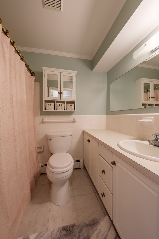 bathroom featuring tile patterned flooring, crown molding, tile walls, and a baseboard heating unit