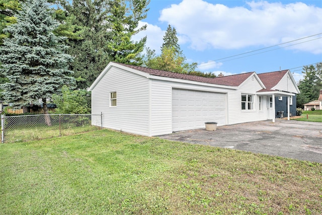 garage with a yard