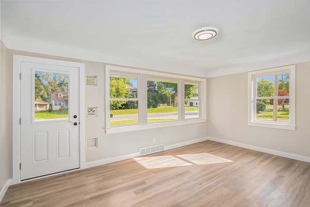 5344 Lapeer Rd, Burton, MI 48509 - entrance foyer featuring healthy amount of natural light, light wood-style flooring, and baseboards