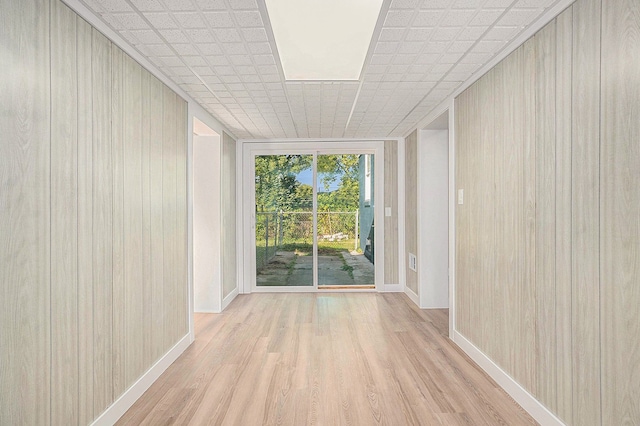 5344 Lapeer Rd, Burton, MI 48509 - spare room featuring wood finished floors, baseboards, and wooden walls