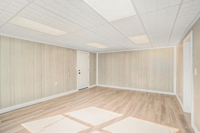5344 Lapeer Rd, Burton, MI 48509 - empty room with wood finished floors, wood walls, and baseboards