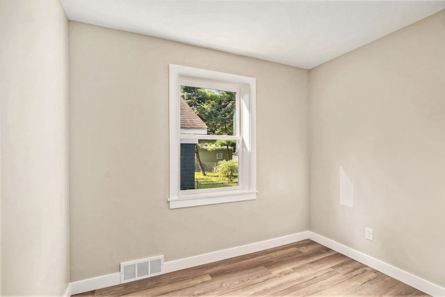 unfurnished room featuring light hardwood / wood-style flooring