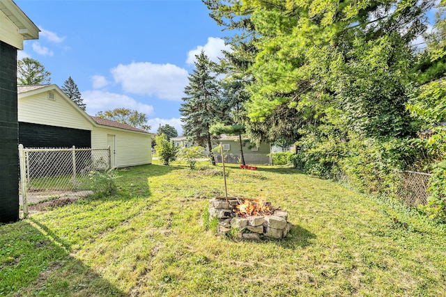 5344 Lapeer Rd, Burton, MI 48509 - view of yard with an outdoor fire pit