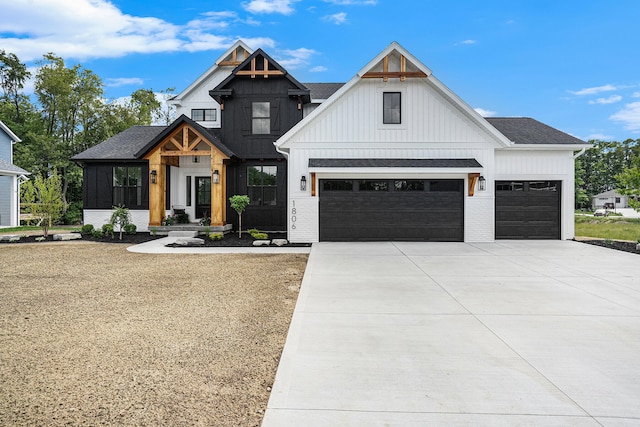 modern inspired farmhouse featuring a sunroom and a garage