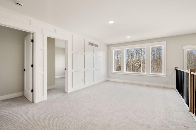 interior space featuring visible vents, recessed lighting, baseboards, and carpet floors