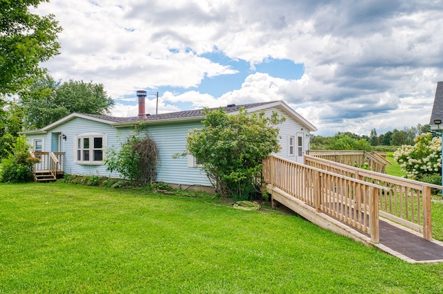 view of yard with a wooden deck