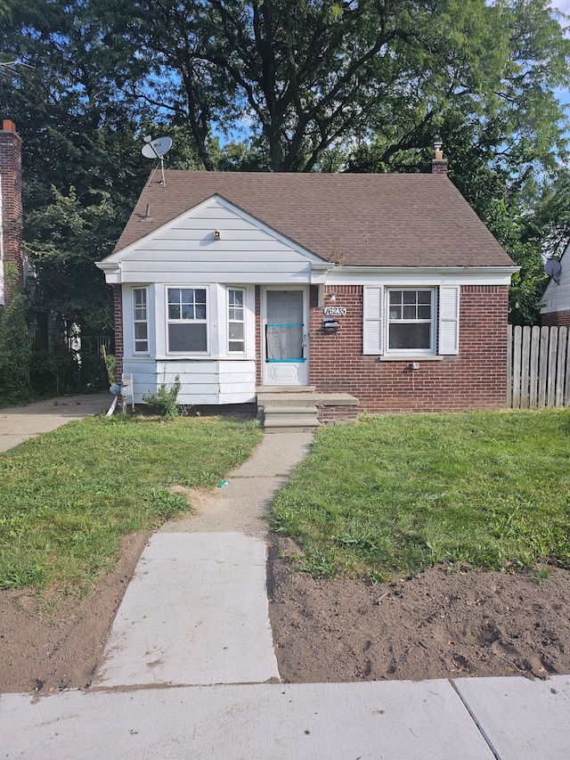 bungalow with a front lawn