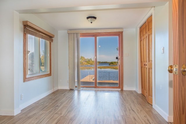 spare room with light hardwood / wood-style flooring