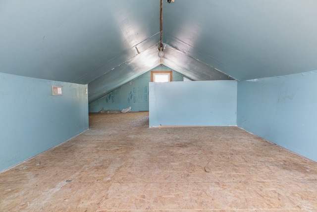 additional living space with vaulted ceiling