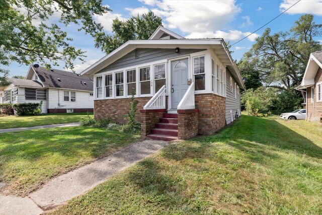 bungalow with a front yard