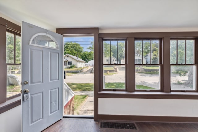 doorway to outside with dark hardwood / wood-style flooring