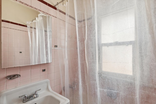 bathroom with a shower with curtain