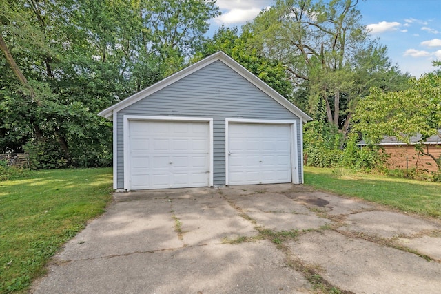 garage featuring a lawn