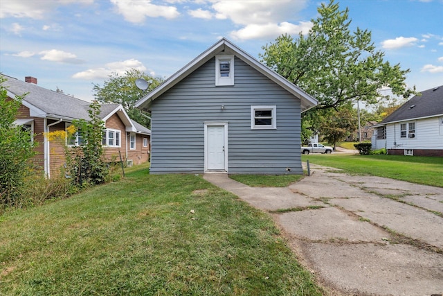 back of house with a yard