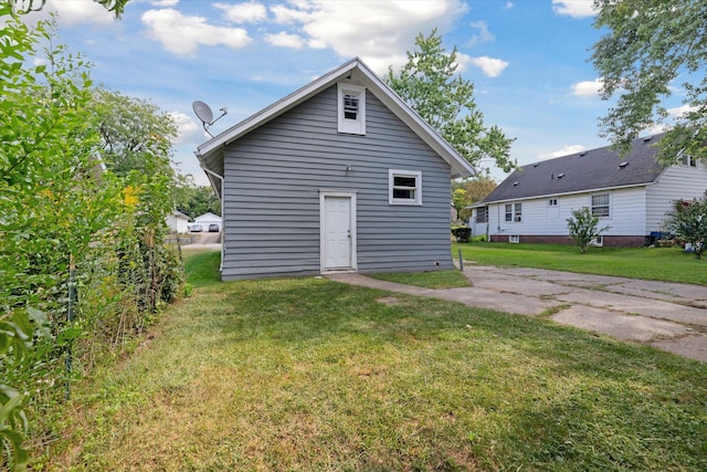 back of house with a yard