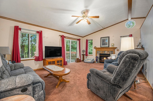 living room with a fireplace, lofted ceiling with beams, plenty of natural light, and carpet flooring