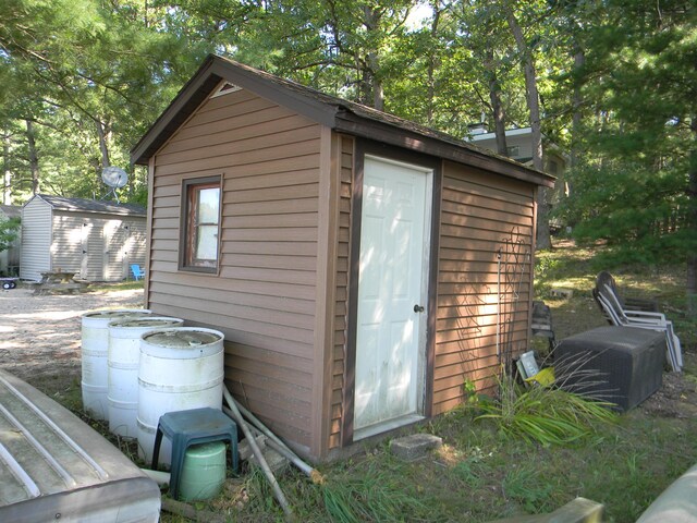 115 S Emerson Dr, Branch, MI 49402 - view of shed with view of wooded area