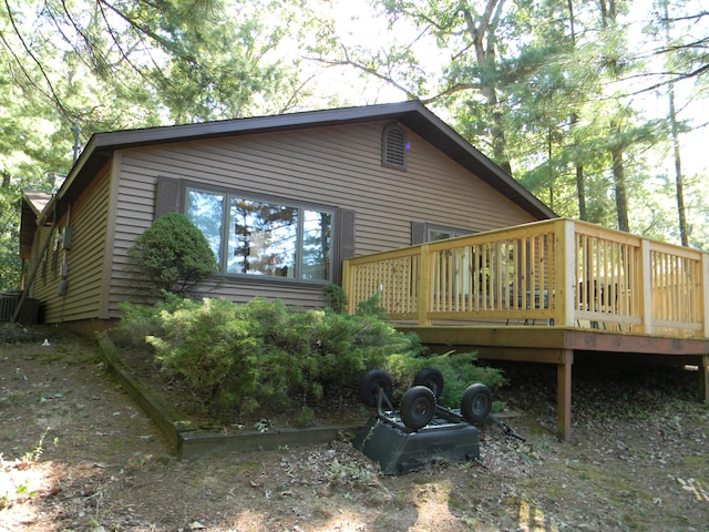 view of home's exterior featuring a deck