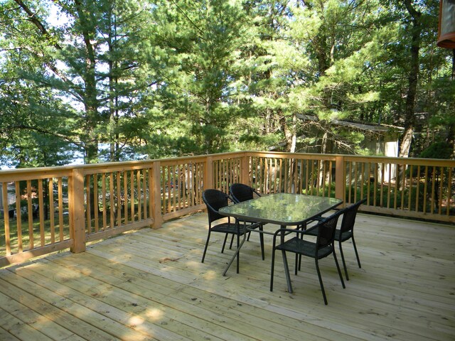 115 S Emerson Dr, Branch, MI 49402 - wooden terrace with outdoor dining area