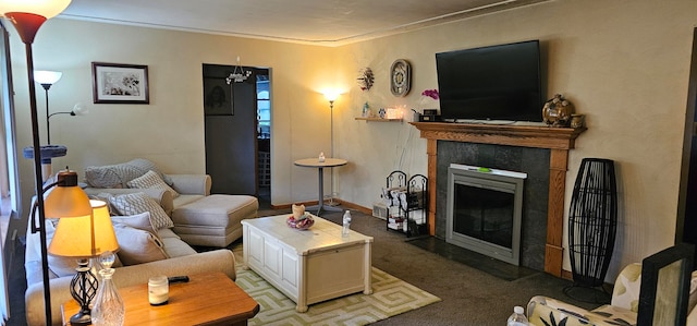 carpeted living room featuring crown molding and a fireplace